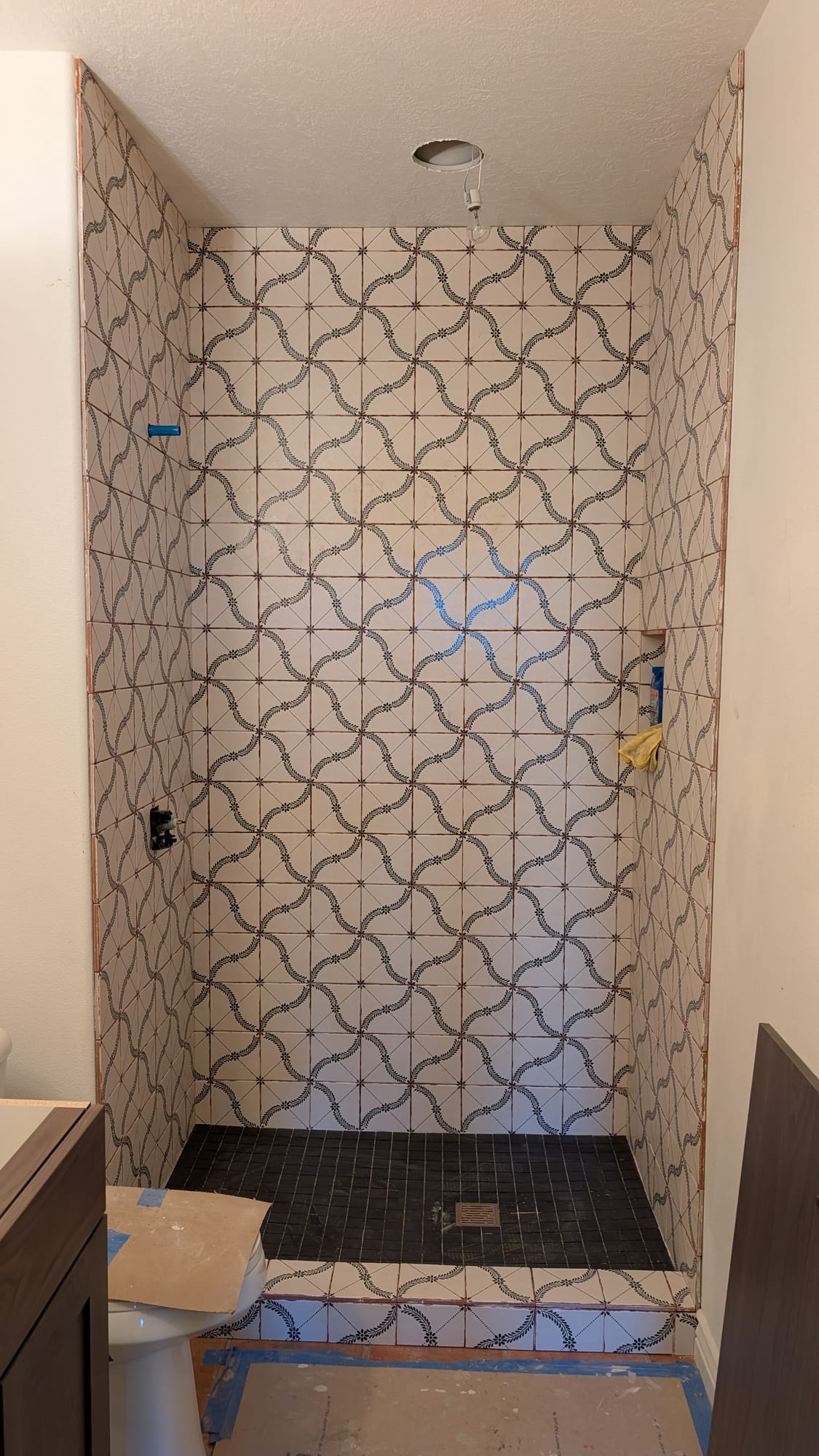 Custom patterned-tile walk-in shower by Haggerty Construction