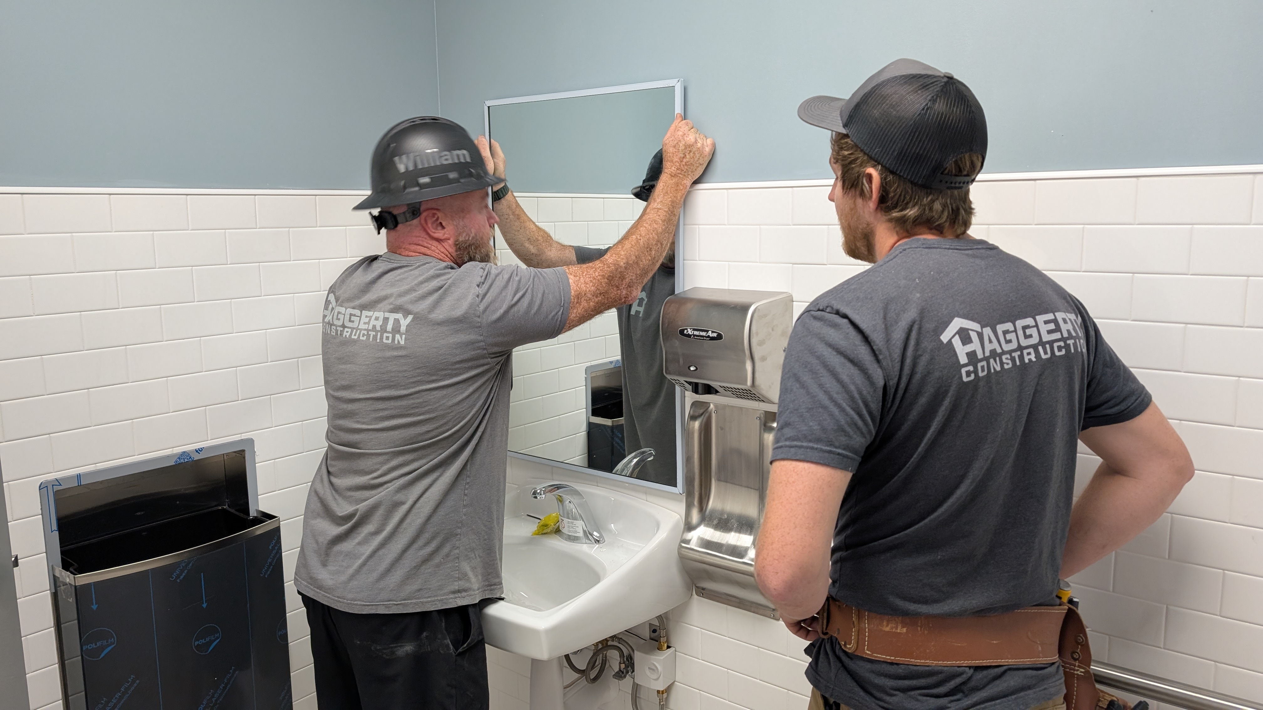 Shower tile installation in progress showing Haggerty Construction attention to detail