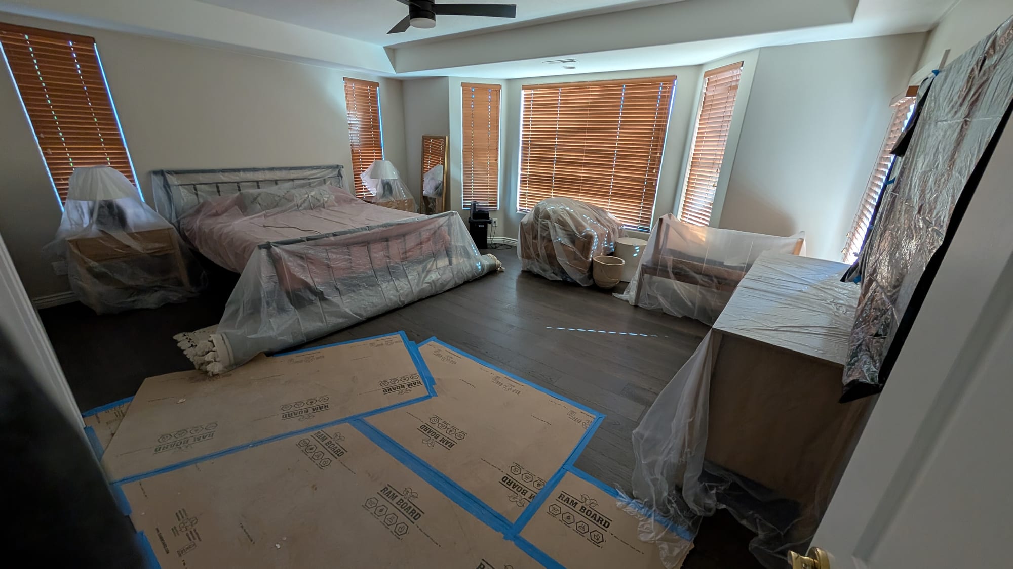 Bedroom furniture and floors carefully protected during a Haggerty Construction remodel