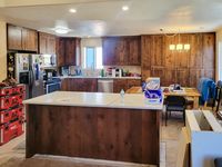 The same kitchen from the other end on handover day, toolboxes still on the floor