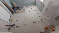 Bathroom wall tile being set during renovation