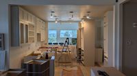 Hardwood flooring installation in progress during whole-home remodel