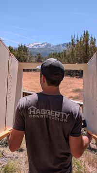 Framing an opening with snowy mountains in the distance