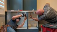 Haggerty Construction installing cabinets during a remodel