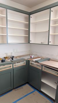 Kitchen cabinet installation progress — another angle