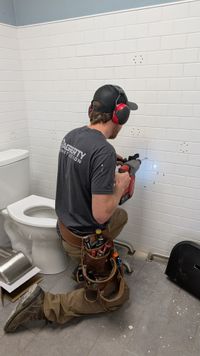 Custom patterned tile shower with geometric design by Haggerty Construction