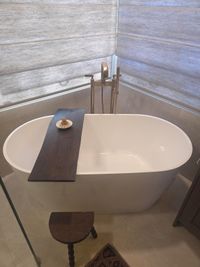 Freestanding soaking tub in a remodeled primary bathroom